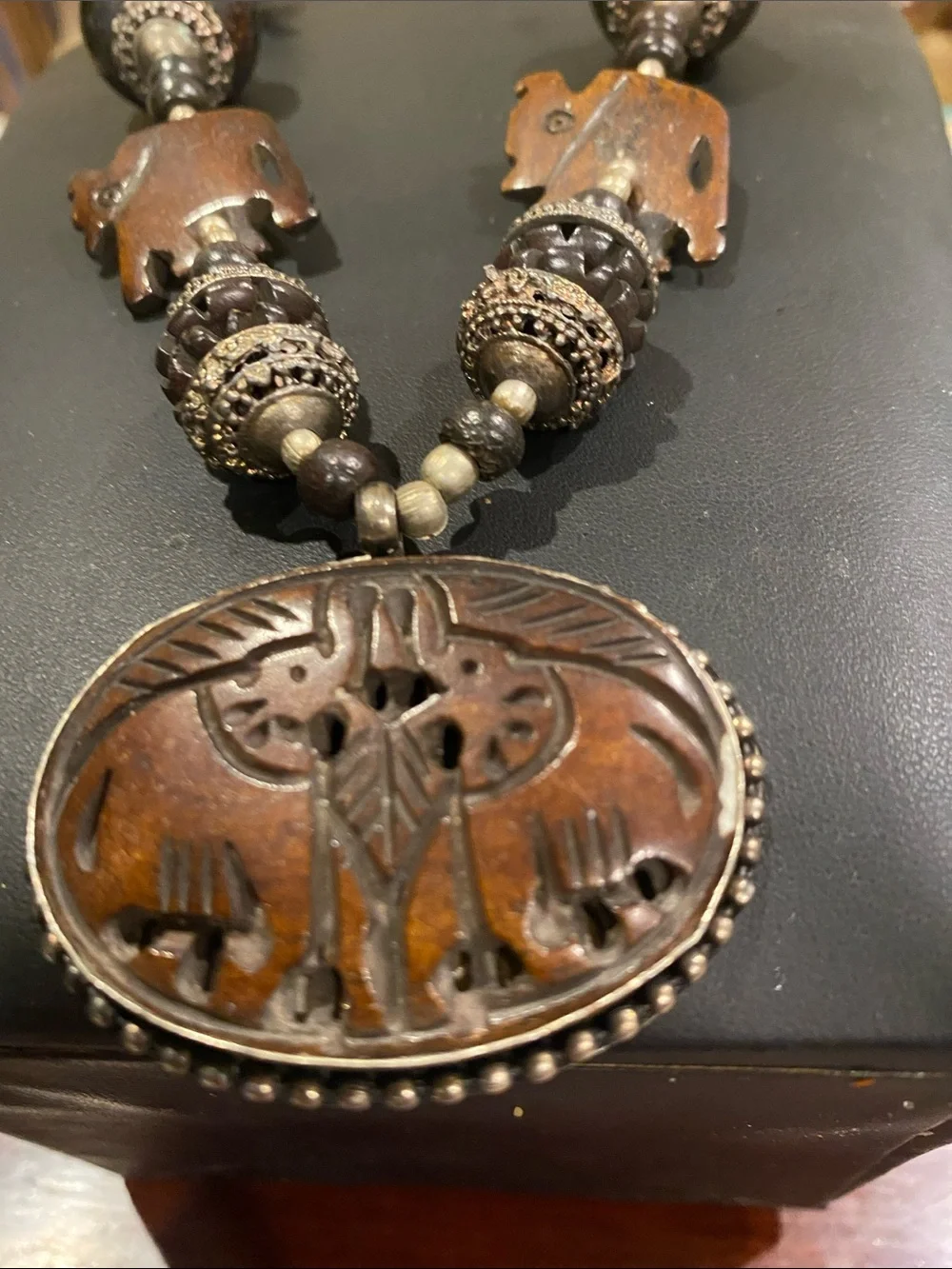 Handcrafted Elephant Pendant Necklace - Brown. Small elephants are bone.